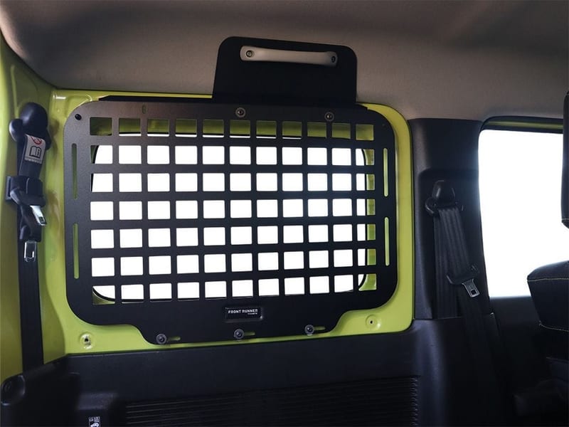 Molle panel fitted over the rear side window of a Jimny 3-door