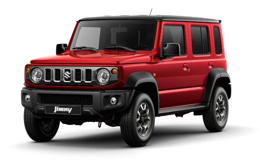 A standard red Suzuki Jimny 5-door with a black roof on a white background