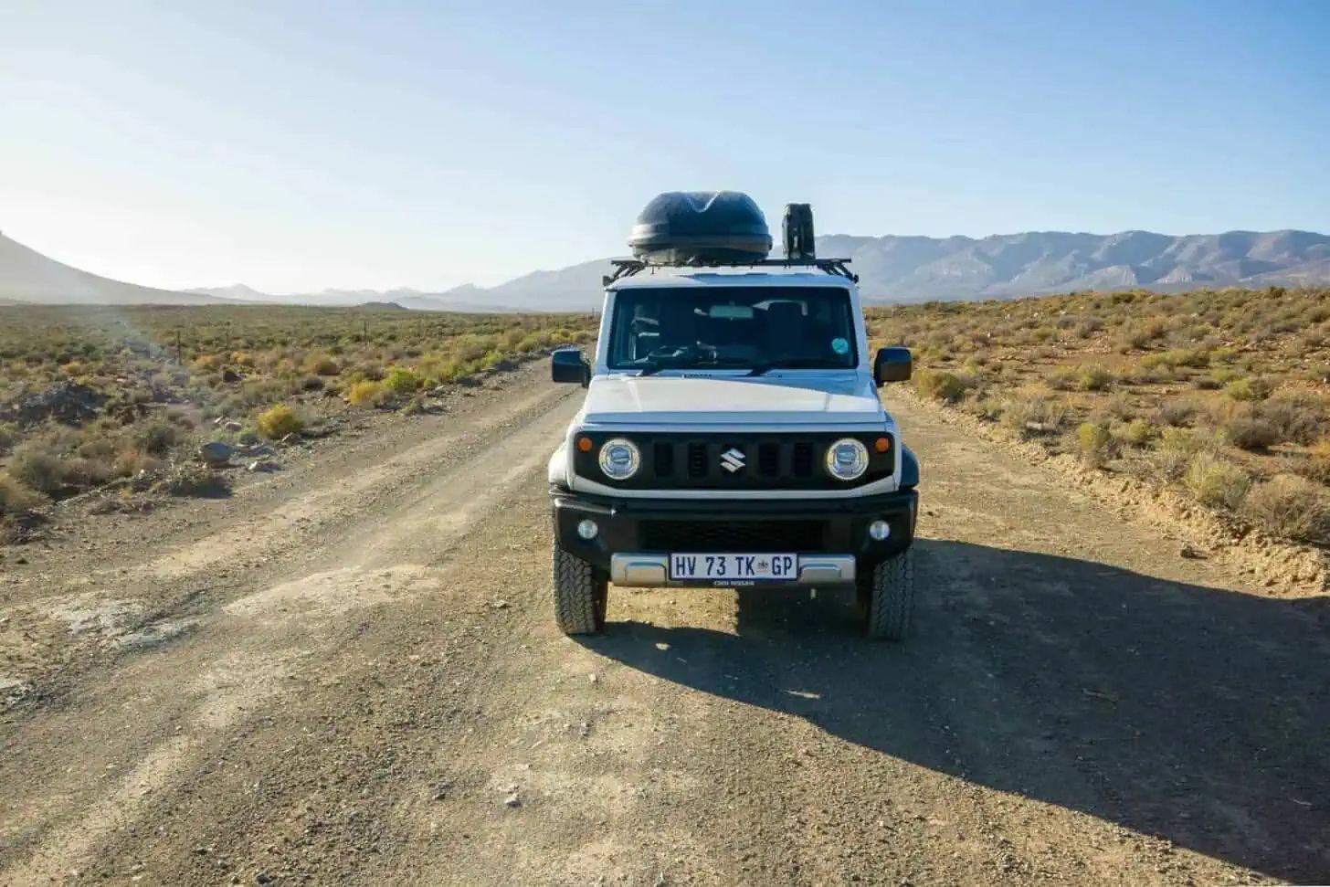 Kitted-out 5-door Suzuki Jimny on a gravel back road in the South African mountains