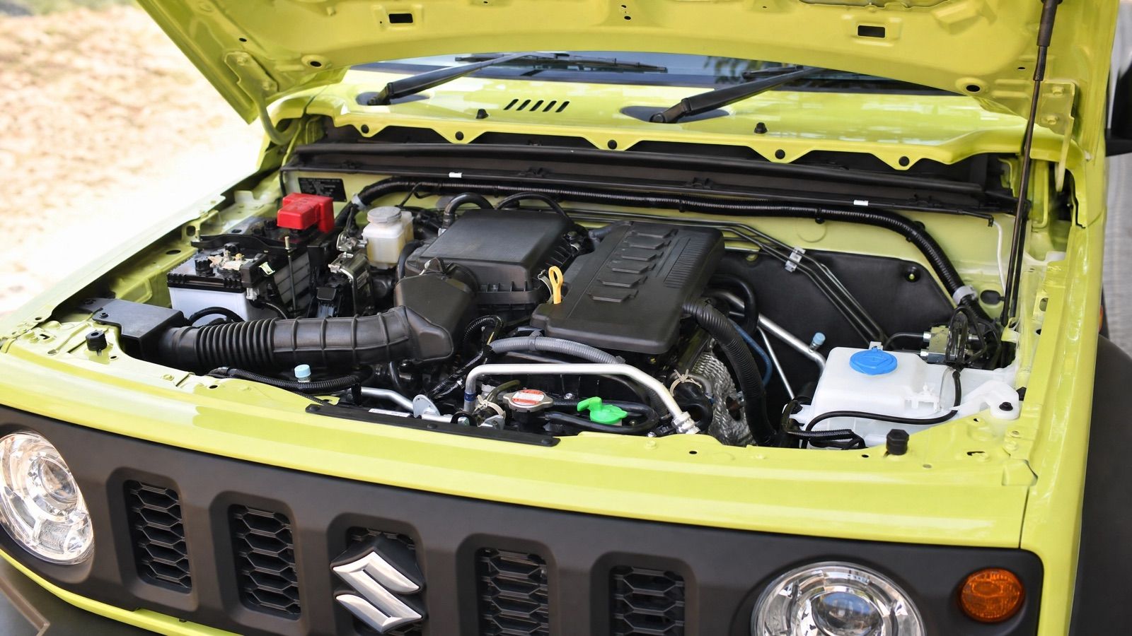 The simple naturally-aspirated 1.5-litre K15B engine bay of a Suzuki Jimny