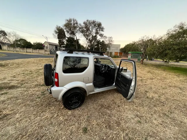 2013 Jimny 1.3 Silver, raised with roofrack